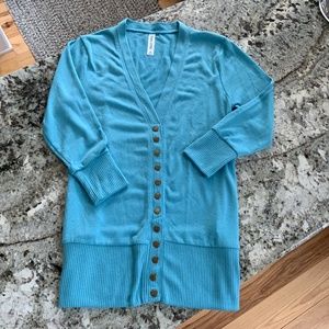 12 snap button aqua cardigan. Women’s size M $16